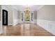 Light-filled dining room featuring hardwood floors and elegant chandelier at 740 Frank Kirk Nw Rd, Kennesaw, GA 30152