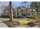 Stately gray house with manicured lawn, stone accents, and a grand entrance at 740 Frank Kirk Nw Rd, Kennesaw, GA 30152