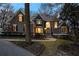 Elegant gray home showcasing a manicured front yard and stunning architectural details at 740 Frank Kirk Nw Rd, Kennesaw, GA 30152