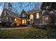 Elegant gray home showcasing a manicured front yard and stunning architectural details at 740 Frank Kirk Nw Rd, Kennesaw, GA 30152