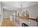 Bright hallway with hardwood floors, large windows and a staircase at 740 Frank Kirk Nw Rd, Kennesaw, GA 30152