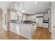 Expansive kitchen with white cabinetry, granite counters, stainless appliances, and an attached breakfast area at 740 Frank Kirk Nw Rd, Kennesaw, GA 30152