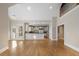 Open living room and kitchen with hardwood floors and plenty of natural light at 740 Frank Kirk Nw Rd, Kennesaw, GA 30152