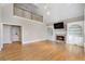 Bright living room featuring built-in shelves and a cozy fireplace at 740 Frank Kirk Nw Rd, Kennesaw, GA 30152