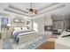 Main bedroom showcases a fireplace, tray ceiling, and natural light at 740 Frank Kirk Nw Rd, Kennesaw, GA 30152