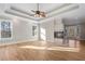 Bright, airy main bedroom with a fireplace and large windows at 740 Frank Kirk Nw Rd, Kennesaw, GA 30152