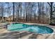 Beautiful backyard pool with stone accents, offering a serene escape and outdoor entertainment space at 740 Frank Kirk Nw Rd, Kennesaw, GA 30152