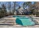 Inviting backyard pool and spa with lush landscaping creates a private outdoor oasis at 740 Frank Kirk Nw Rd, Kennesaw, GA 30152