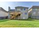 Back of the house showcasing the deck and well-maintained lawn at 106 Little Barley Ln, Grayson, GA 30017