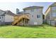 Expansive backyard featuring a wooden deck and lush green lawn at 106 Little Barley Ln, Grayson, GA 30017