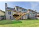 Back of the house showcasing the deck, well-maintained lawn, and manicured shrubs at 106 Little Barley Ln, Grayson, GA 30017