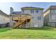 Back of the house showcasing the deck and well-maintained lawn at 106 Little Barley Ln, Grayson, GA 30017