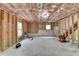 Unfinished basement featuring framing, concrete walls and floors, and small windows at 106 Little Barley Ln, Grayson, GA 30017