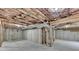 Unfinished basement showcasing exposed insulation and concrete foundation walls and floor at 106 Little Barley Ln, Grayson, GA 30017