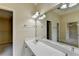 Bathroom featuring double sink vanity and walk in closet at 106 Little Barley Ln, Grayson, GA 30017