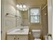 Neutral bathroom with white vanity, mirror and shower/tub combination at 106 Little Barley Ln, Grayson, GA 30017