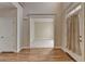 Bright foyer featuring hardwood floors, natural light, and an open view into another room at 106 Little Barley Ln, Grayson, GA 30017