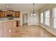 Eat-in kitchen area showcases wooden floors and modern light fixture at 106 Little Barley Ln, Grayson, GA 30017