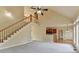 Open living space with staircase and view of the kitchen at 106 Little Barley Ln, Grayson, GA 30017