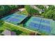 Aerial view of well-maintained community tennis courts, perfect for recreation at 106 Little Barley Ln, Grayson, GA 30017