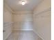 Spacious walk-in closet featuring wrap around shelving for optimal storage at 106 Little Barley Ln, Grayson, GA 30017