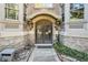 Arched entrance features elegant wood doors and stone accents at 1156 Piedmont Ne Ave # B3, Atlanta, GA 30309