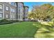 Well-maintained exterior with lush lawn and shade trees at 1156 Piedmont Ne Ave # B3, Atlanta, GA 30309