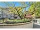 Exterior shot of Piedmont Hall apartment building with mature trees at 1156 Piedmont Ne Ave # B3, Atlanta, GA 30309