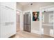Kitchen with stainless steel refrigerator and access to rooms with hardwood floors at 1156 Piedmont Ne Ave # B3, Atlanta, GA 30309