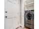 This laundry area features a large capacity washer and storage shelving at 1156 Piedmont Ne Ave # B3, Atlanta, GA 30309