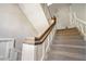 Classic staircase with carpeted steps and a wooden handrail adds charm to this multi-Gathering home at 1156 Piedmont Ne Ave # B3, Atlanta, GA 30309