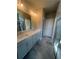 Bathroom with double sinks, a walk-in shower and gray tile at 274 Lakeside Pl, Canton, GA 30114