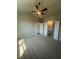 Bedroom with a fan and two doors to the bathroom and hallway at 274 Lakeside Pl, Canton, GA 30114