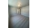 Carpeted bedroom with neutral paint, ceiling light, and open door at 274 Lakeside Pl, Canton, GA 30114