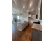 Open concept kitchen with stainless steel appliances, granite countertops and hardwood floors at 274 Lakeside Pl, Canton, GA 30114