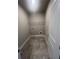 Neutral toned laundry room with tile flooring and wire rack shelf at 274 Lakeside Pl, Canton, GA 30114