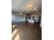 Spacious living room with vaulted ceilings, hardwood floors, and a chandelier at 274 Lakeside Pl, Canton, GA 30114
