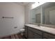 Bathroom featuring vanity with granite countertops and gray cabinets, mirror, brushed nickel fixtures, toilet and towel racks at 325 Forkview Dr, Lawrenceville, GA 30044