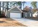 Charming home with a two-car garage and landscaped front yard at 325 Forkview Dr, Lawrenceville, GA 30044