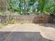 Private backyard featuring a wood fence, lush landscaping and a stone patio, perfect for relaxing and enjoying nature at 1421 Gates Se Cir, Atlanta, GA 30316