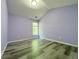 Cozy bedroom with hardwood flooring, light purple walls, and a window at 1421 Gates Se Cir, Atlanta, GA 30316