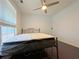 Comfortable bedroom featuring wood floors, ceiling fan, and natural light from a window at 1421 Gates Se Cir, Atlanta, GA 30316