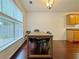 Bright dining room with natural light, wood floors, and modern light fixture at 1421 Gates Se Cir, Atlanta, GA 30316
