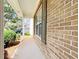 Classic brick exterior of home, framed with a view of greenery and the driveway at 1421 Gates Se Cir, Atlanta, GA 30316