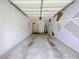 Attached garage with shelving, water heater, and decorative accent wall at 1421 Gates Se Cir, Atlanta, GA 30316