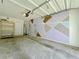 Attached garage with shelves and a geometric design wall provides parking and storage at 1421 Gates Se Cir, Atlanta, GA 30316