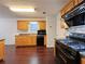 Traditional kitchen with black appliances, wood cabinets, and dark countertops at 1421 Gates Se Cir, Atlanta, GA 30316