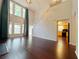 Living room featuring a fireplace, hardwood floors, and access to the backyard and kitchen at 1421 Gates Se Cir, Atlanta, GA 30316