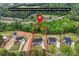 Aerial view of home, grounds, and landscaping in neighborhood with marked property lines at 1255 E M Croy Rd, Sugar Hill, GA 30518