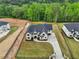 Aerial view of home, grounds, and landscaping in neighborhood at 1255 E M Croy Rd, Sugar Hill, GA 30518